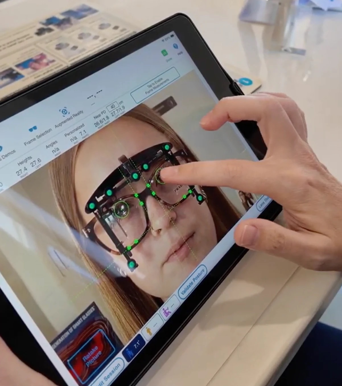 Digital eyewear measurement on a tablet at Aura Eye Center